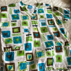 Size medium print scrub top with hearts and shamrocks